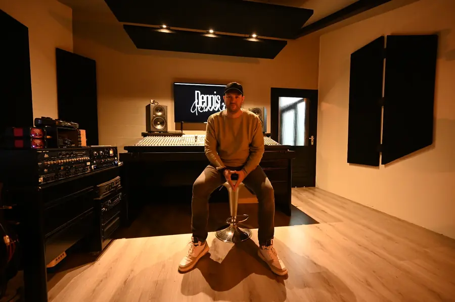 Dennis Geraads, drummer and producer, behind the Soundcraft mixing console in the control room of his recording studio in Echt